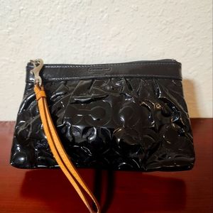 Coach brand, black patent leather wristlet